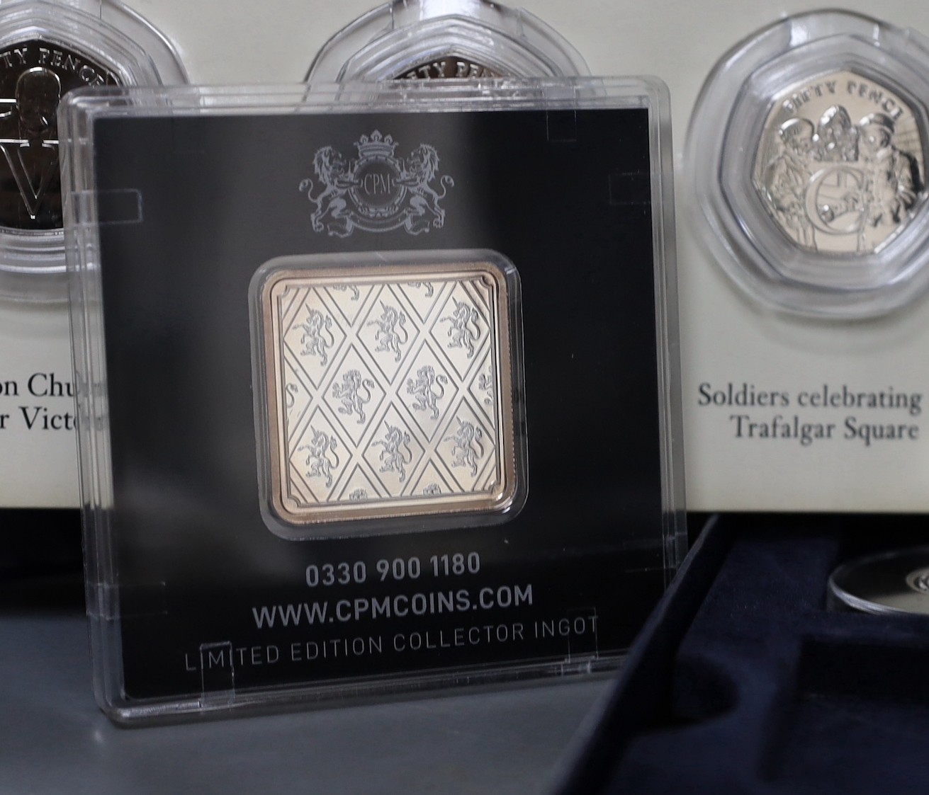 A change checker album of uncirculated coins etc.